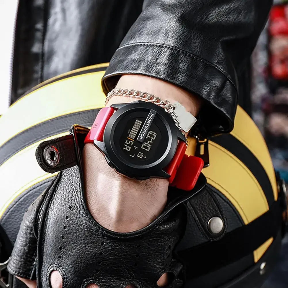 Person wearing a black and red digital watch with leather jacket and helmet