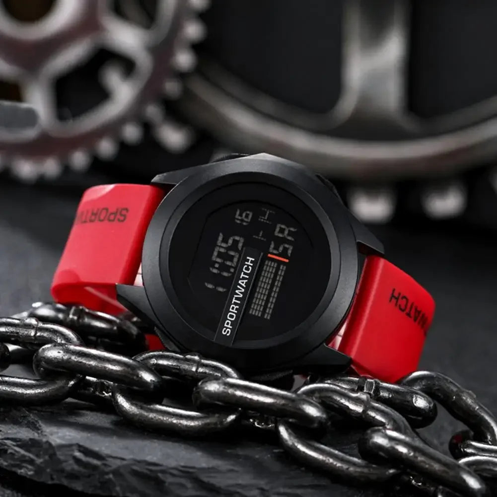 Digital watch with red accents on a chain against a mechanical gear background