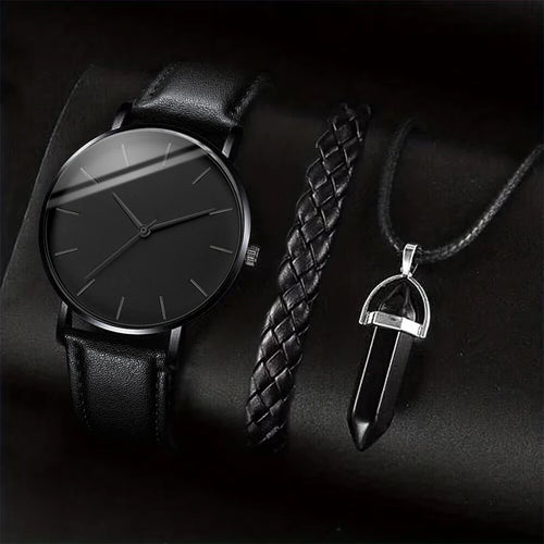 Black leather watch and pendant on a dark background