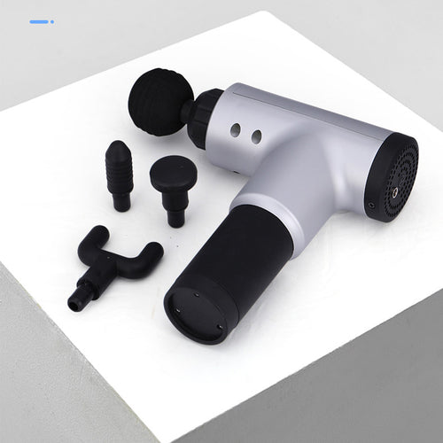 Massage gun with attachments on a white background