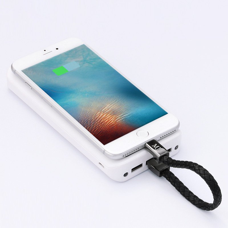 Phone with power bank and USB cable on a white background