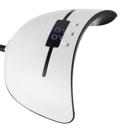 White nail dryer with digital display on a white background